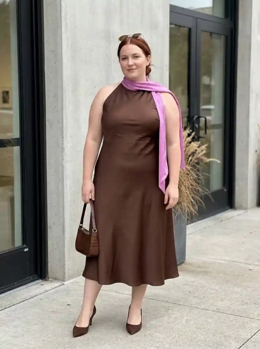 Chocolate brown satin halter-neck midi dress styled with lavender scarf tied at the neck