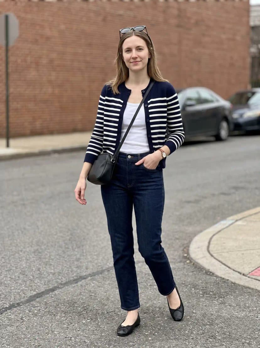 White ribbed tank top, navy and white striped cardigan, dark wash jeans, black ballet flats, and black crossbody bag