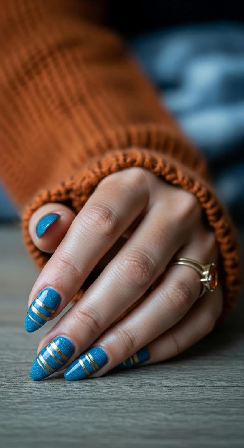 Blue Glitter Nails with Gold Stripes