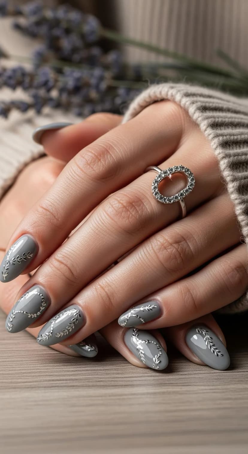 Grey Oval Almond Nails with Silver Leaf Decals