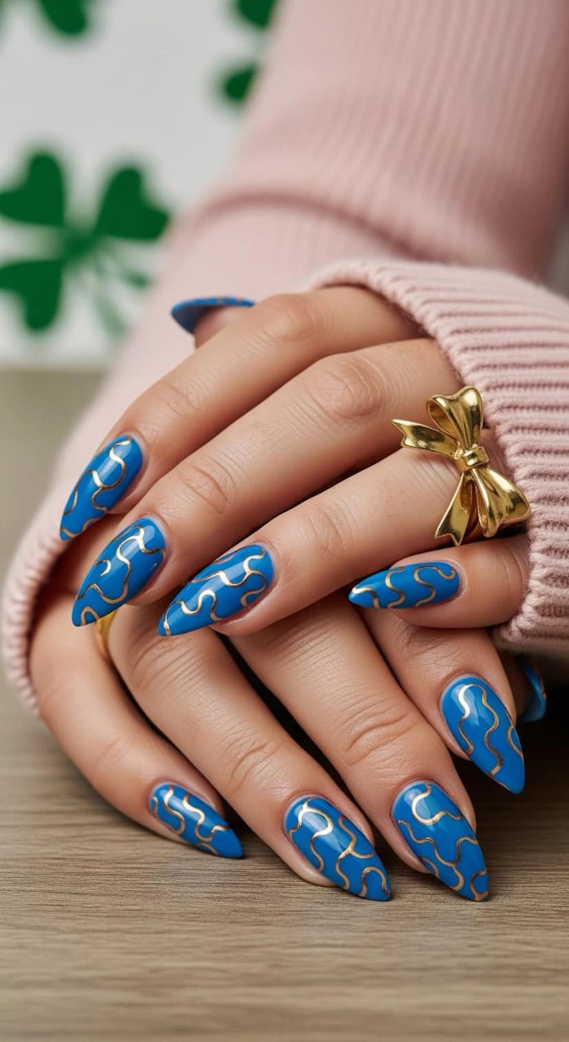 Blue Swirl Stiletto Nails + Gold Bow Ring + Pink Ribbed Sweater