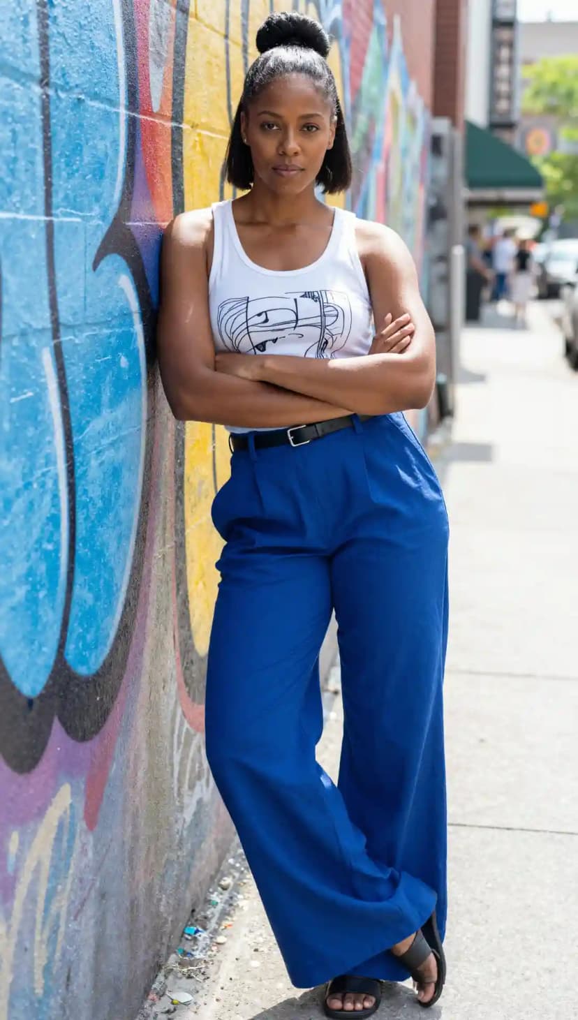 White Graphic Tank Top + Royal Blue Wide-Leg Trousers + Black Leather Belt + Black Flat Sandals