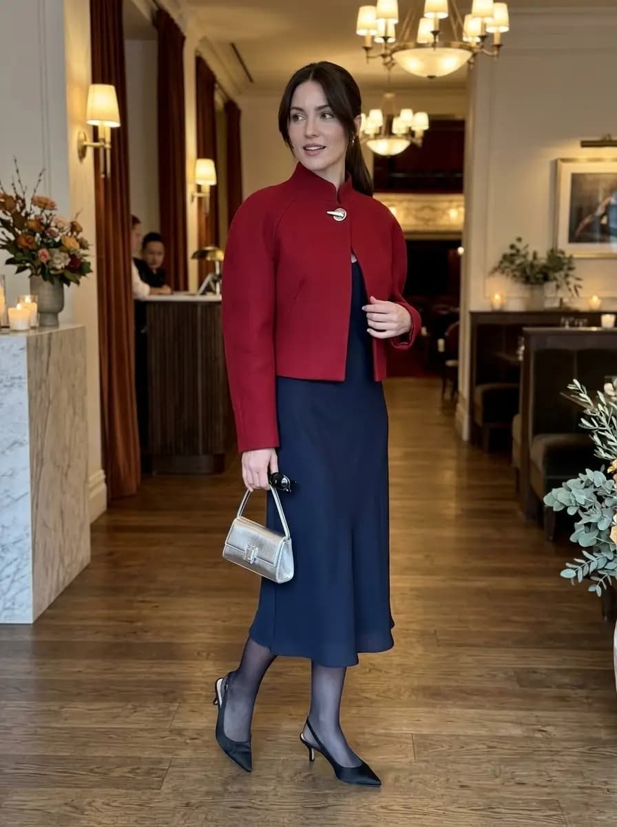 Navy midi slip dress with cropped red jacket and slingback heels