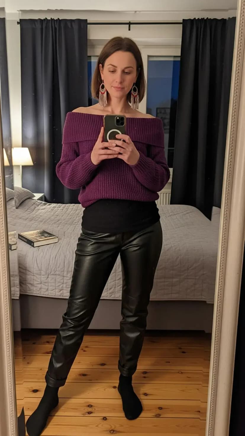 Off-shoulder plum sweater + black base layer + black faux-leather joggers + statement fringe earrings
